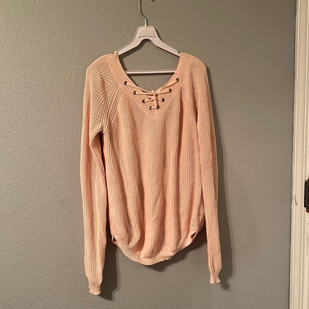 Light pink sweater with lace up front